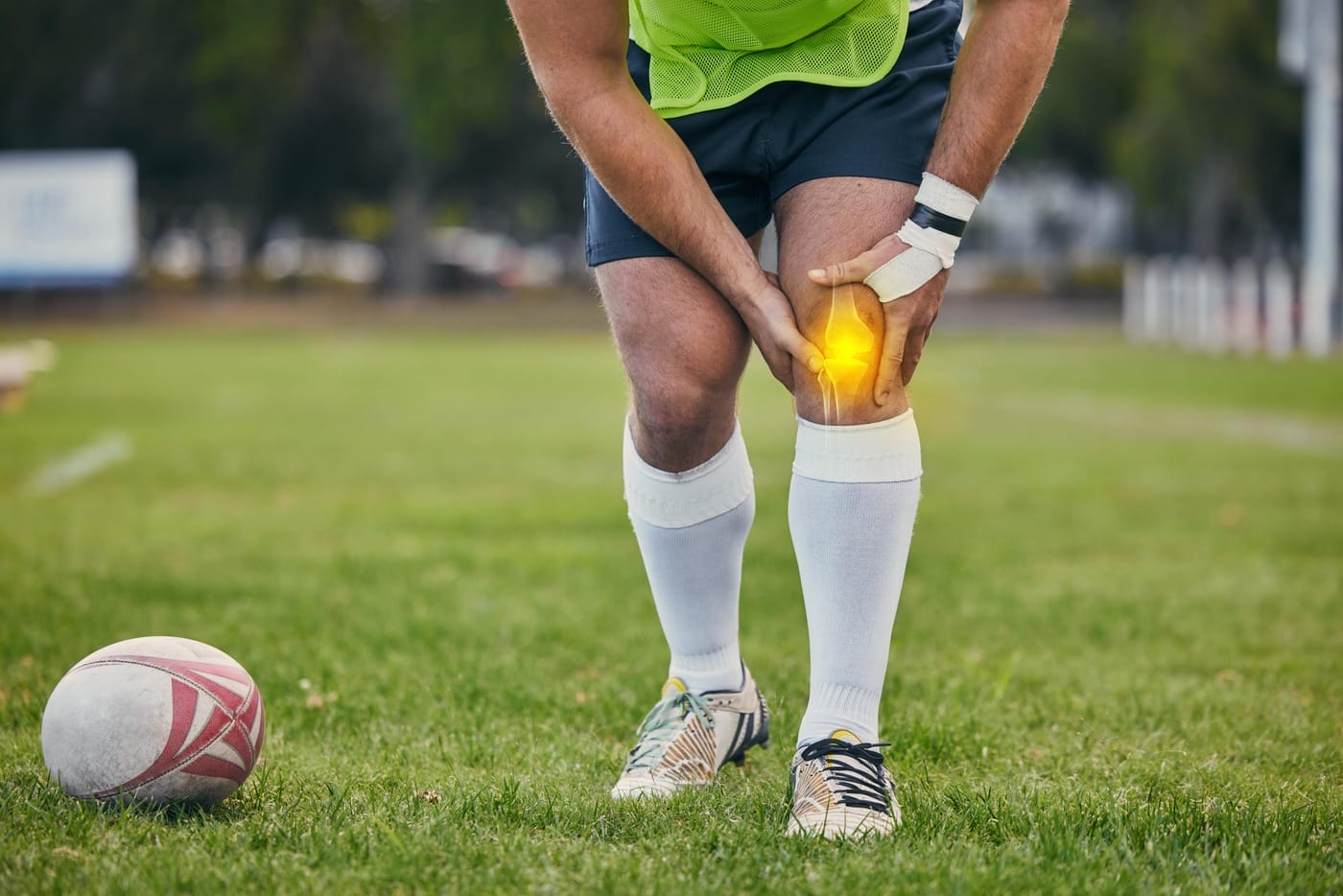 Rugby, pain and man with knee injury on sports field