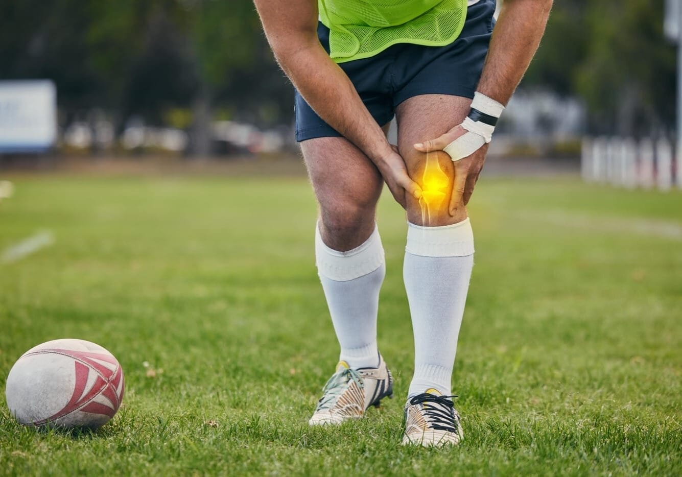 Rugby, pain and man with knee injury on sports field